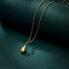 #104 tiny gold drop pendant