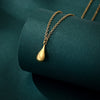 #104 tiny gold drop pendant